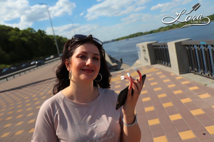 Photo session of long nails on the embankment of the Dnieper river in Kiev