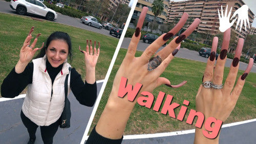 Public place. Short walk in Alicante. Woman with long nails