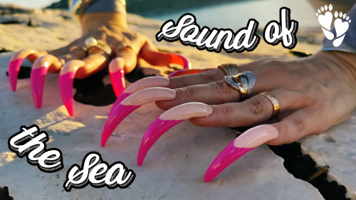 The sea behind & Long pink-tipper nails